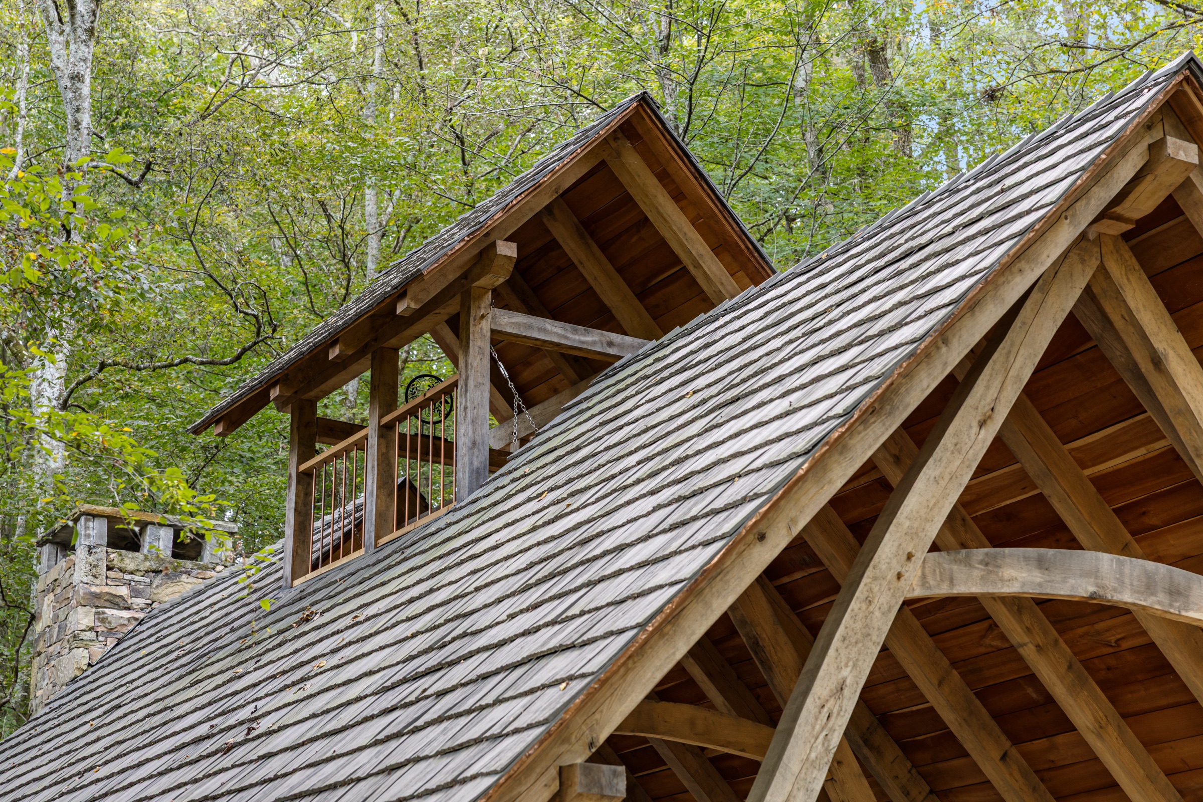 Curved cruck timbers on a pavilion roof