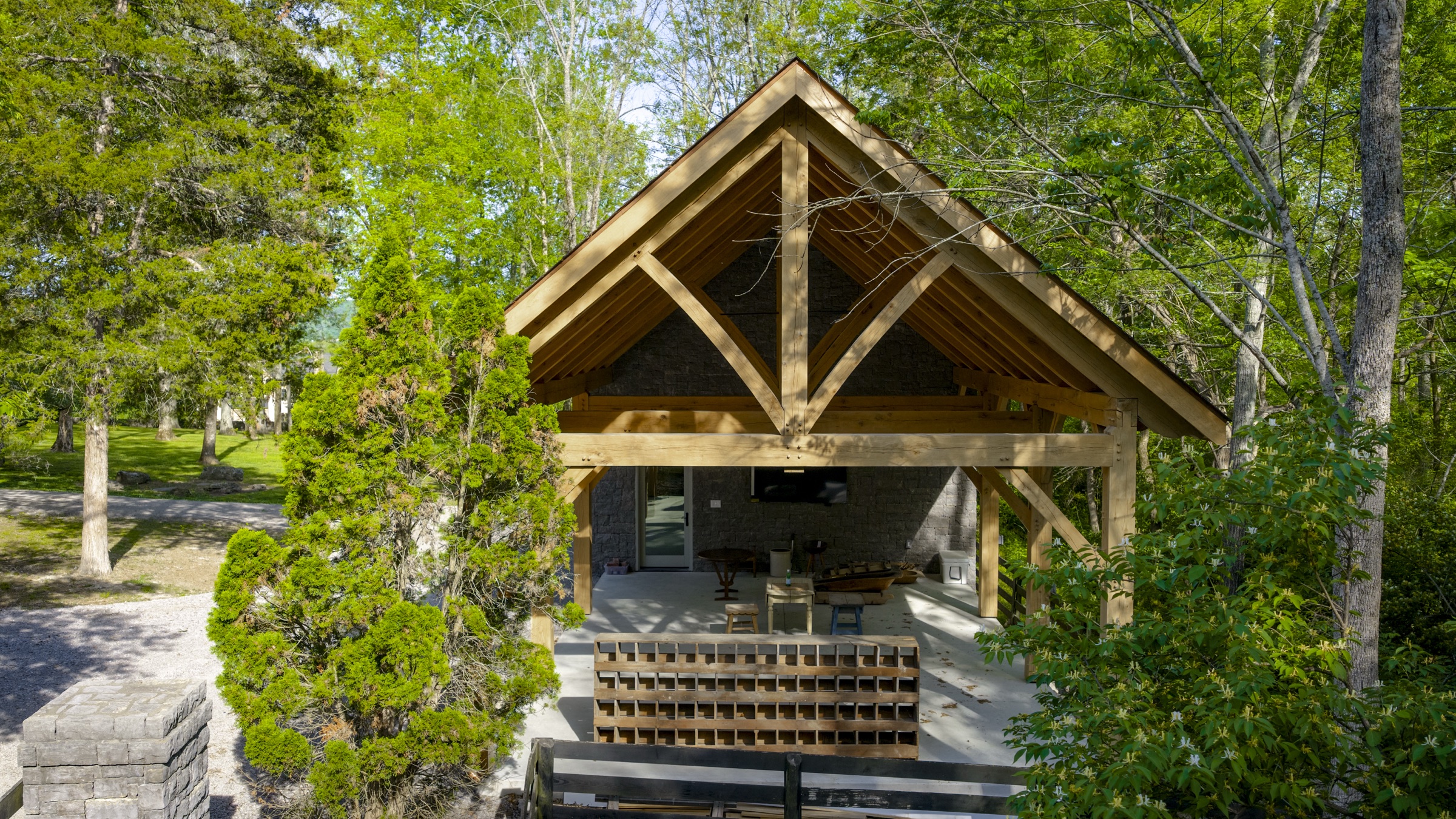 Angled exterior of timber and stone workshop