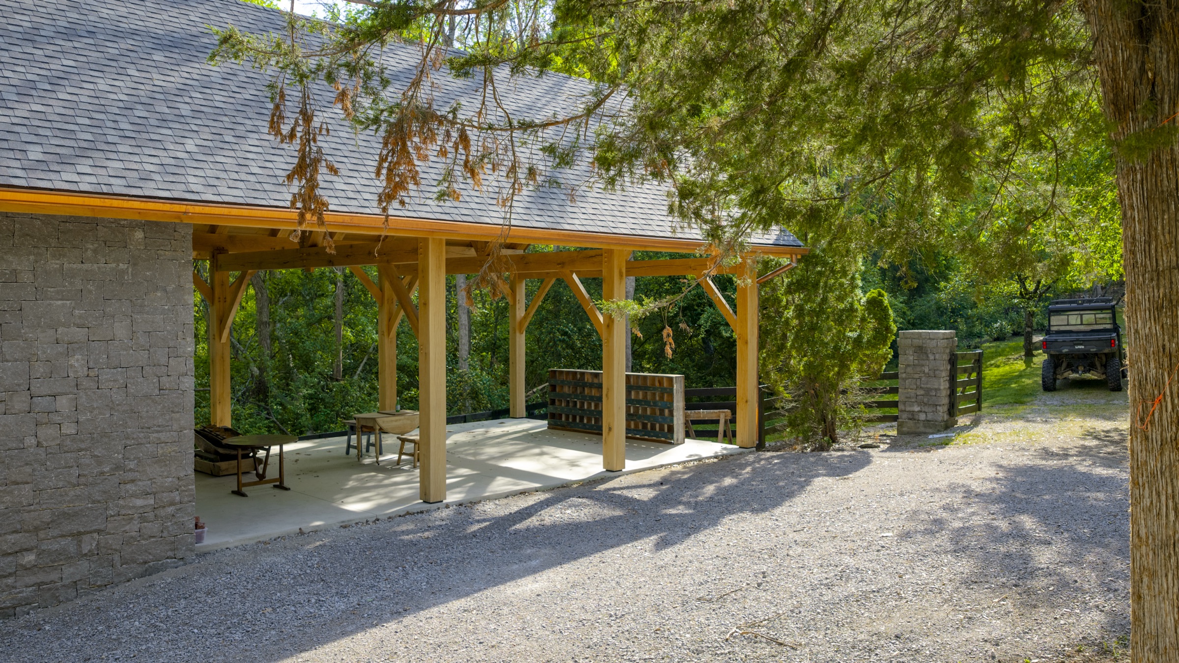 Gray stone workshop in a wooded setting