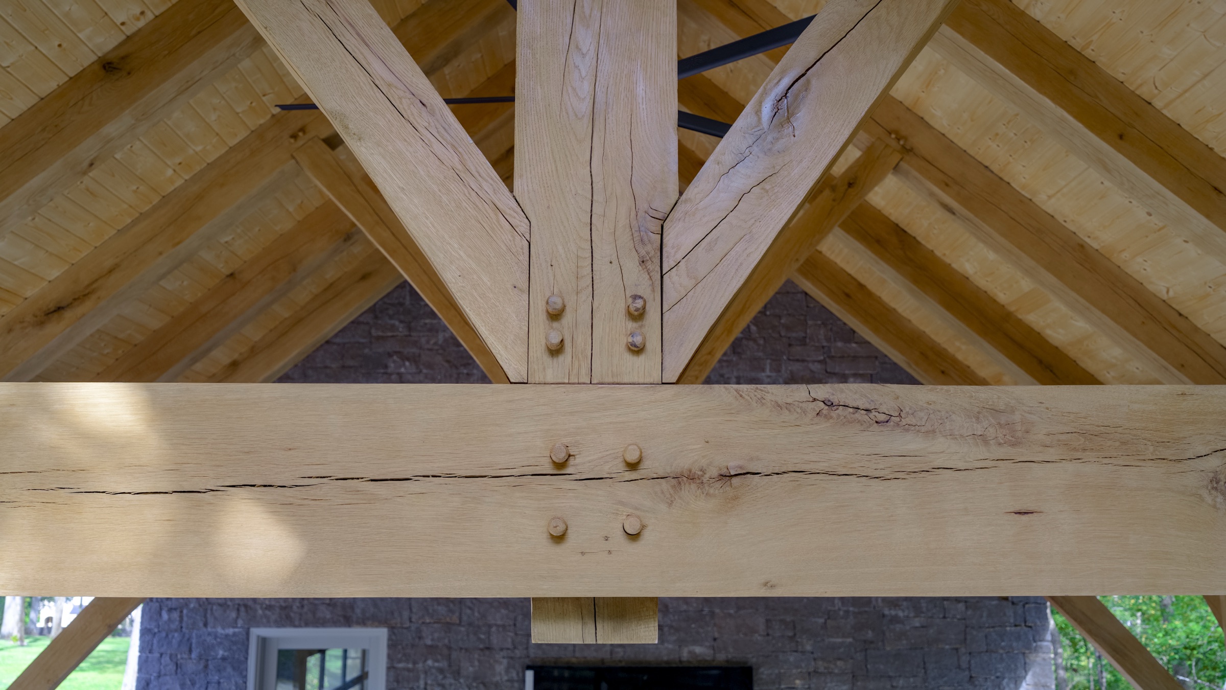 Close view of pegged mortise and tenon joinery on gray stone